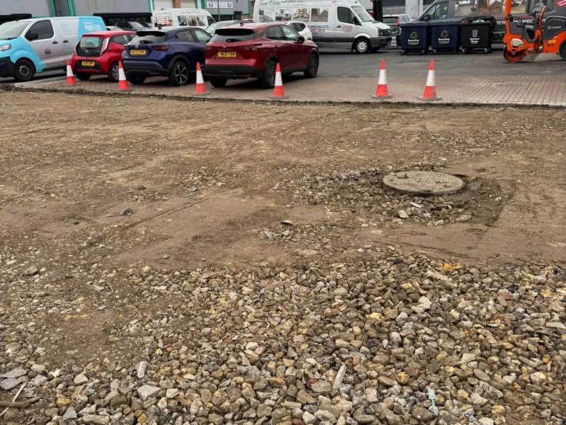 Close up of flattened land after grass removal in preparation for new car park