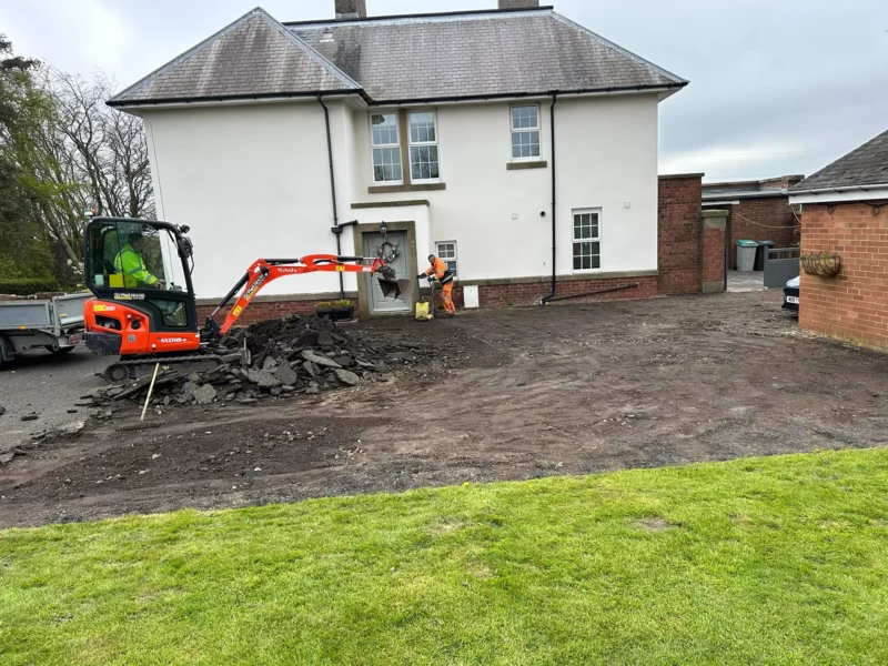 WW Contracts team removing old driveway in front of house
