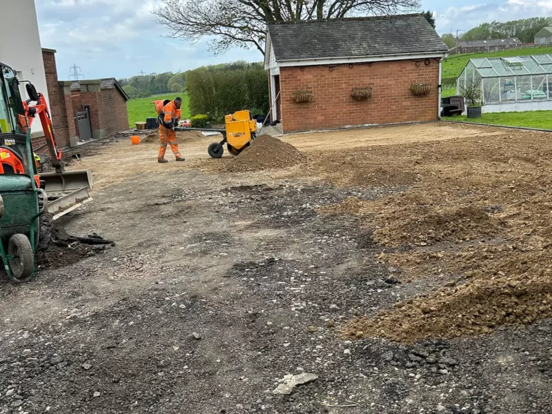 WW Contracts team removing old driveway in front of garage