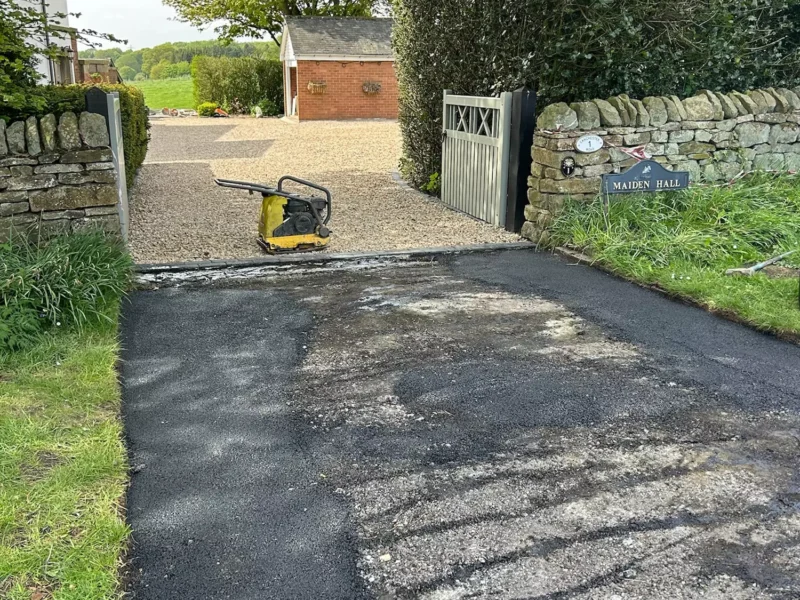 Work started on tarmac entrance to a driveway