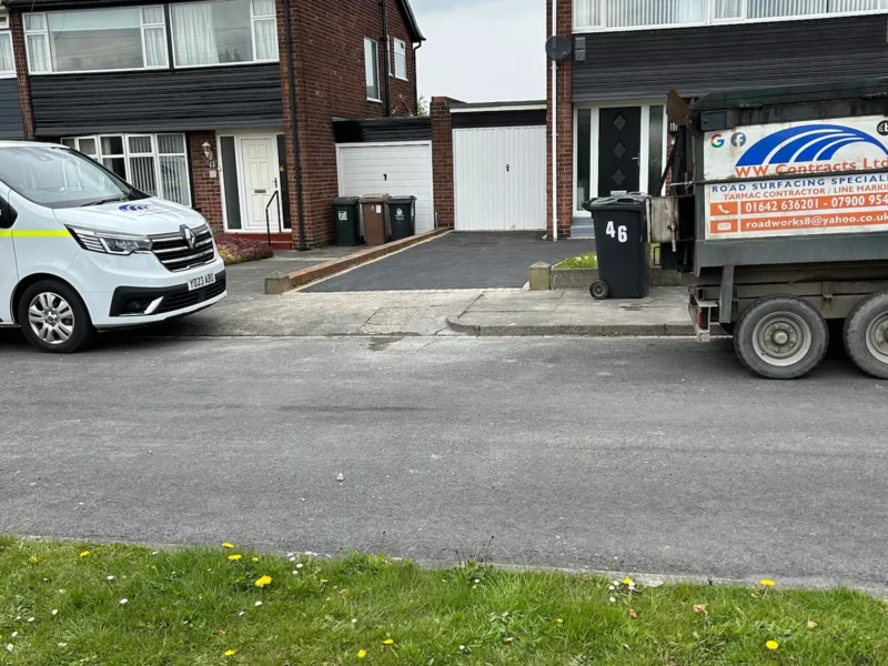 WW Contracts van in front of a house with newly installed tarmac drive