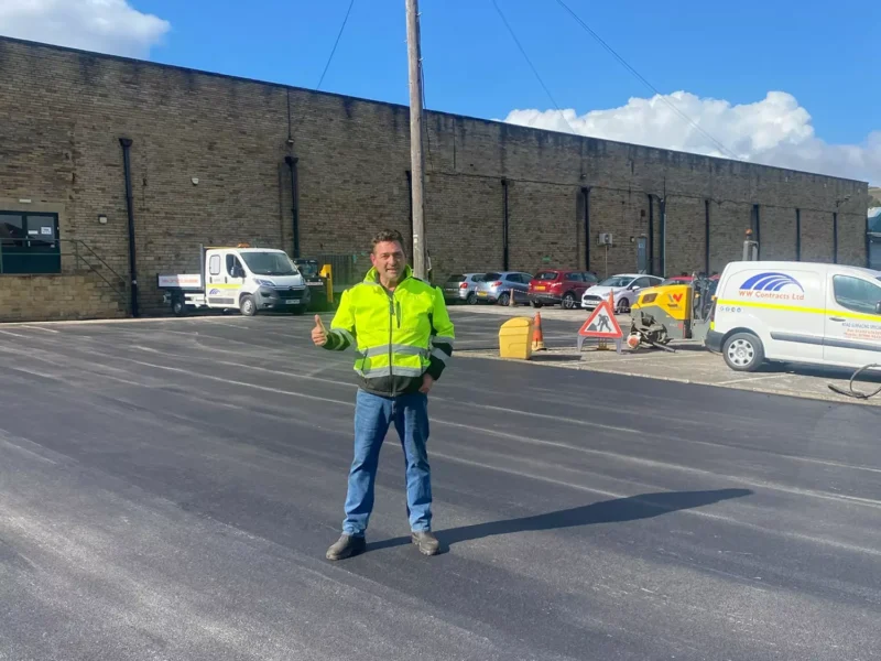 WW Contract showing a new tarmac carpark in front of a long, stone commercial building