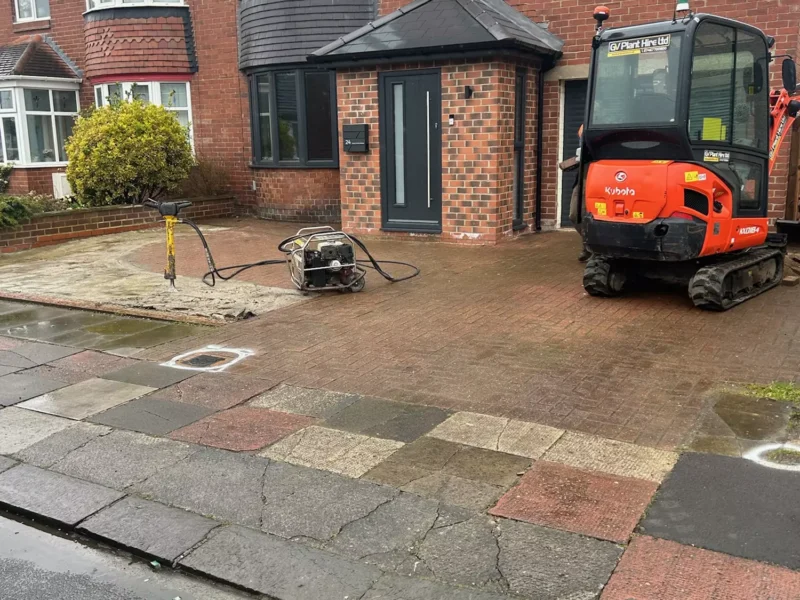 Old block paved driveway in front of a residential property