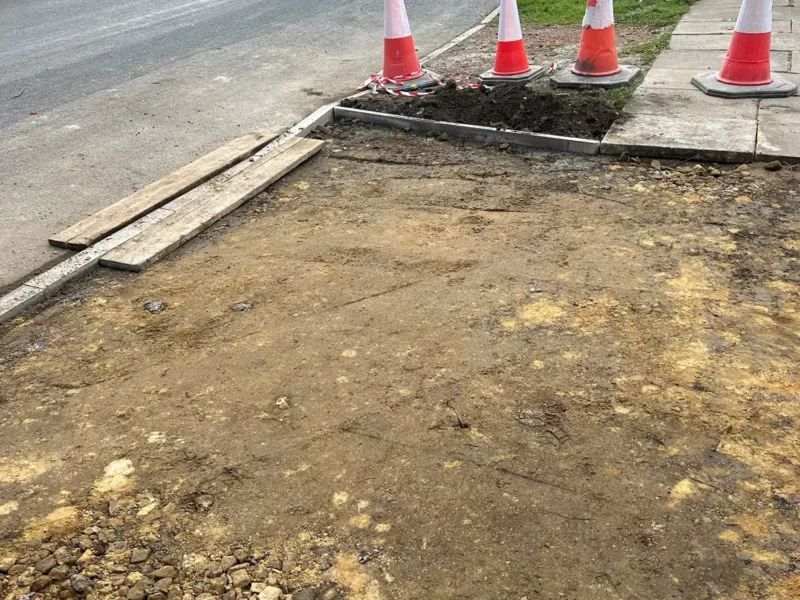 Closeup of flattened ground after an old drive has been removed