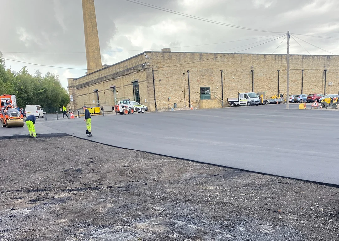 WW Contract working on laying a large tarmac carpark
