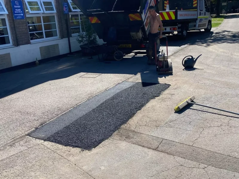 WW Contracts fixing a pothole in a carpark