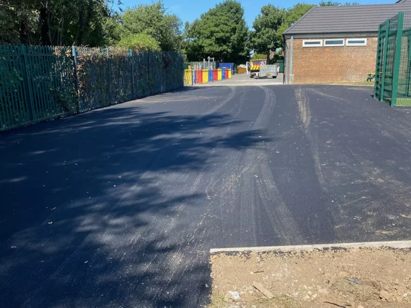 A new large tarmac area in front of a brick building