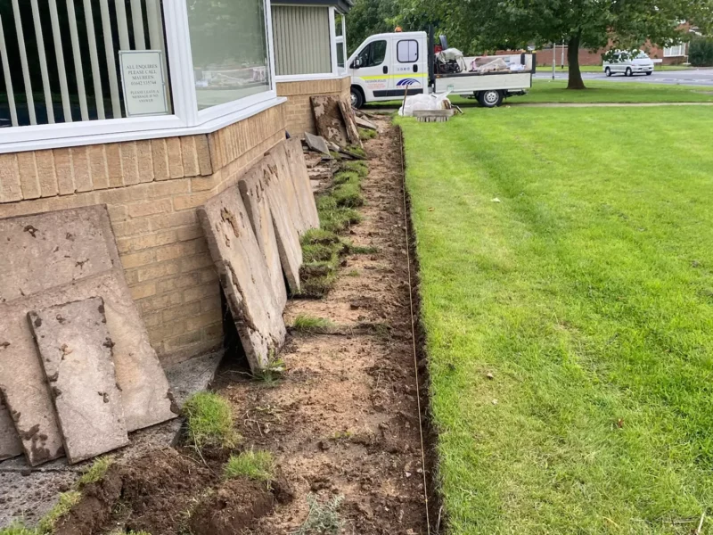 Old paving slabs removed from in front of community centre