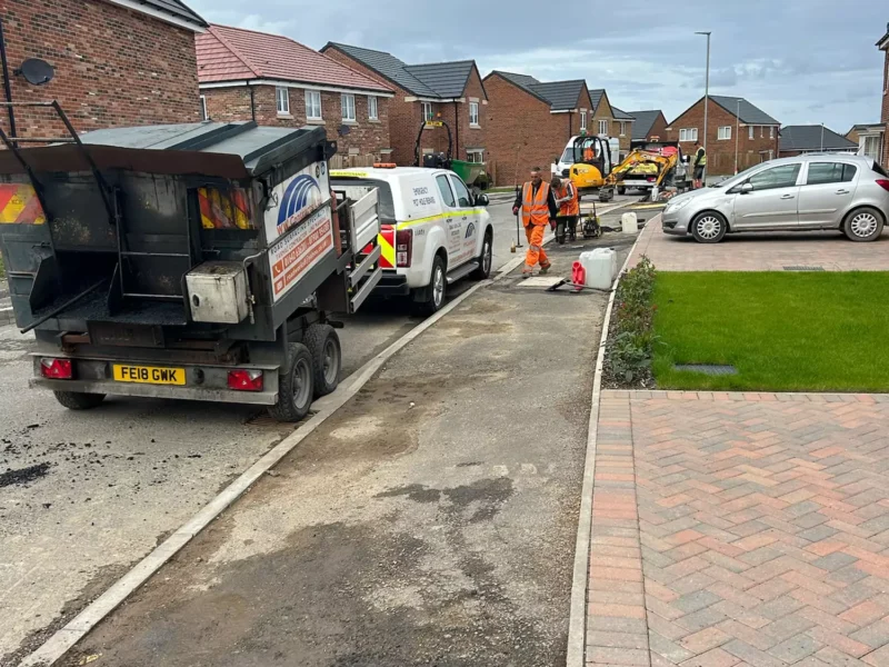 New tarmac path being laid in a residential street