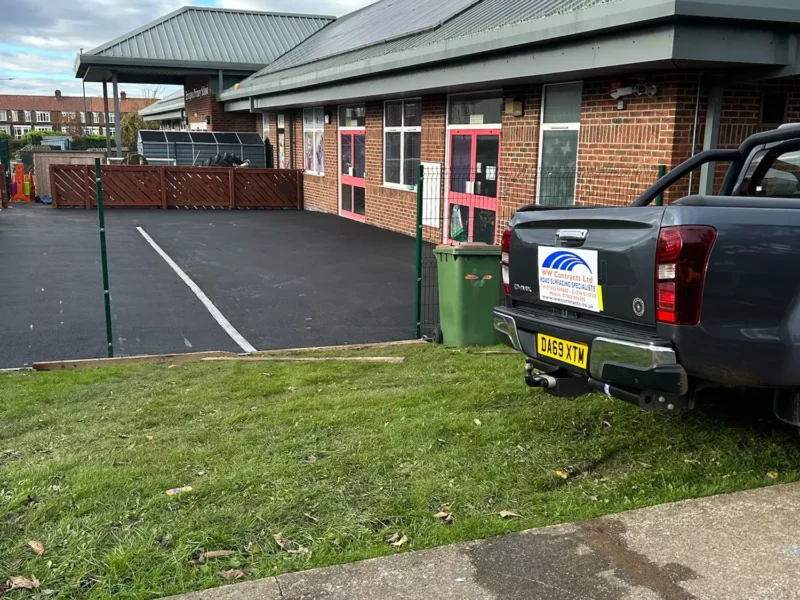 Close up of new tarmac on a School playground, with WW Contracts Van in the foreground