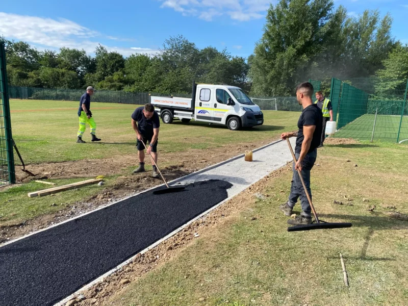 Workers from WW Contracts installing a new tarmac path