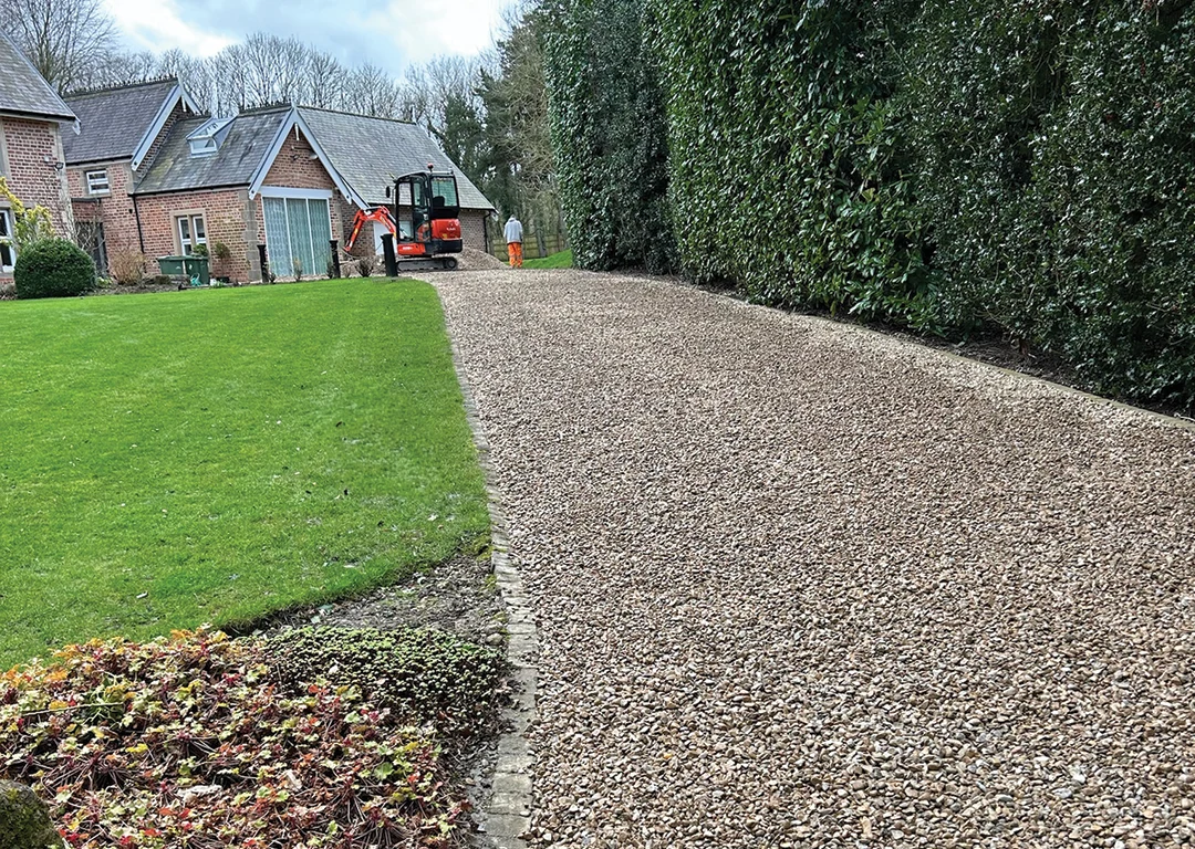 WW Contracts workers installing a gravel driveway
